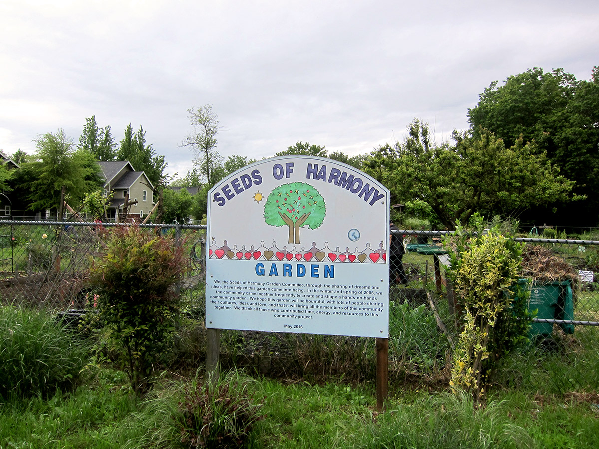 Seeds of Harmony garden sign recognizing the volunteer work that went into the garden's creation